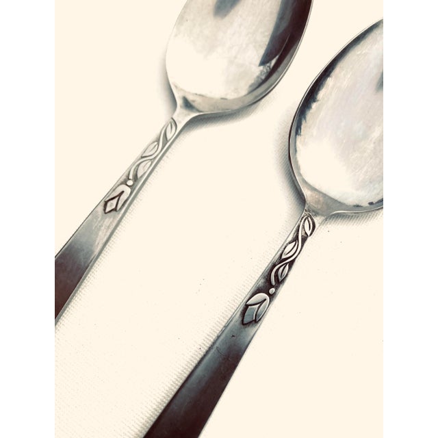 Midcentury stainless steel tulip time pattern set of 2 serving spoons 8.25"L , makers mark reads " Amefa Stainless...