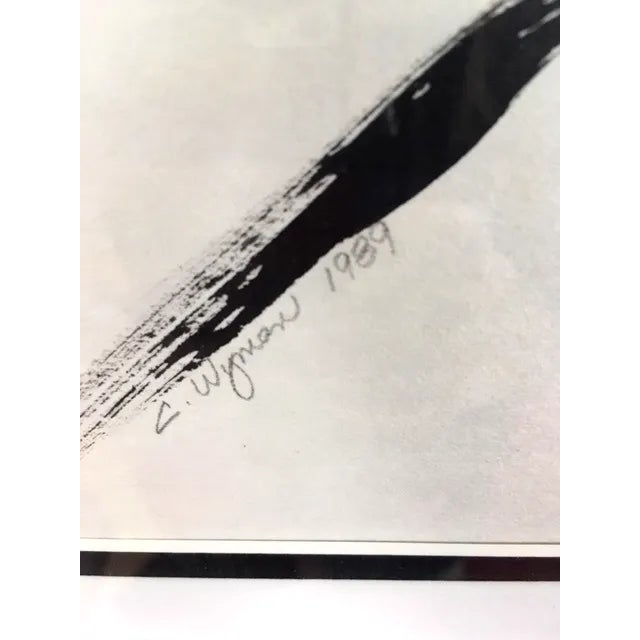 This 1980's black and white minimalist figure of a woman is pencil signed C. Wyman. It is triple matted and framed in faux...