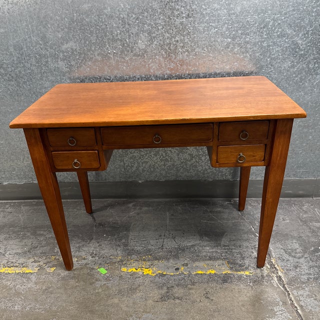 Design Plus Gallery presents the Five Drawer Traditional Writing Desk from Sklar-Peppler. This vintage wood desk offers a...