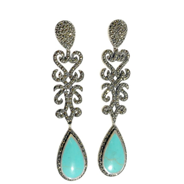 These Vintage Sterling Silver Stud Earrings feature Marcasite Stones set with a Turquoise Stone drop of approximately...