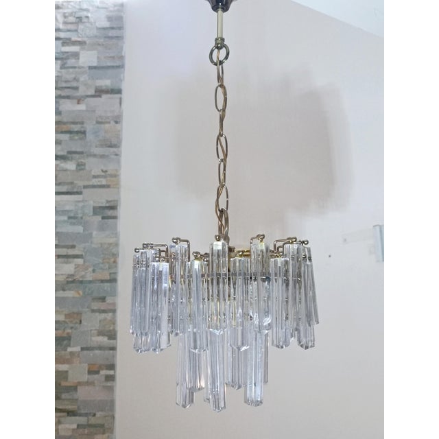Magnificent cascade chandelier by Venini. Italy, 1960s. Brass frame. It features magnificent Murano glass pendants....