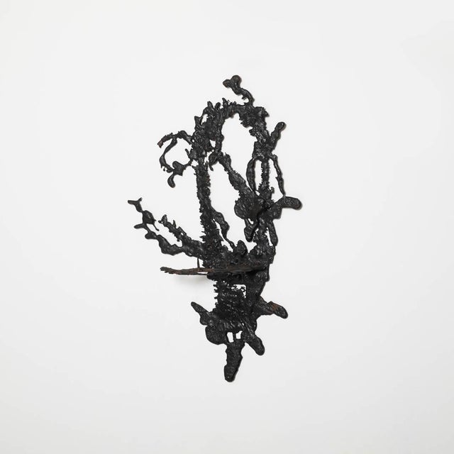 Wall candelabra made od spilled iron creating a free form composition, one of a kind. Poland, circa 1960. Up to 250V...