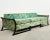 Fantastic mid-century modern upholstered gondola sofa made in the style and manner of James Mont. The chic sofa features a...