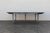 Beautiful antique French Provincial dining table dating to circa 1920s, featuring an impressive large oval form and...