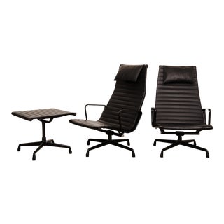 Eames Blacked Out Aluminum Group Lounge Chairs and Foot Stool - 3 Pieces For Sale