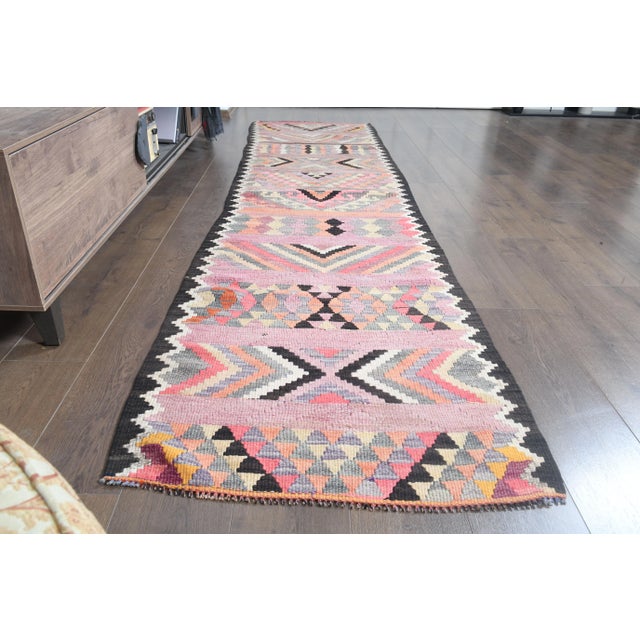 Vintage Turkish Hand-Knotted vintage rug is a semi- vintage runner rug.'70s Eastern region of Turkey's unique rug is...