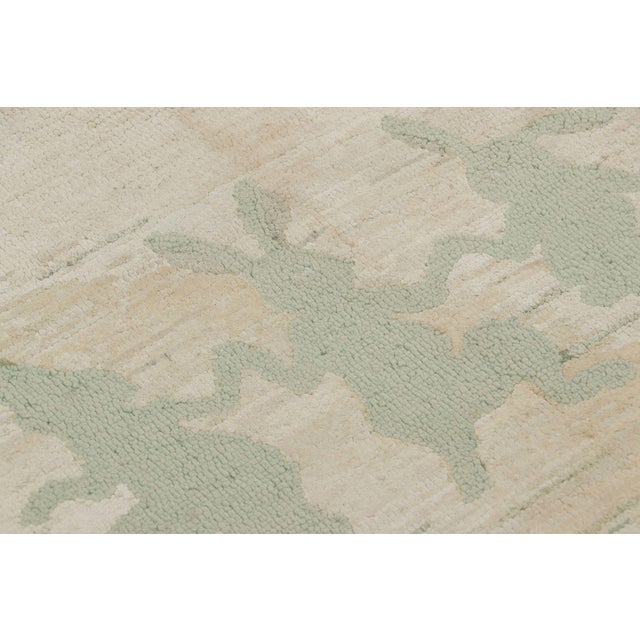 Handmade in wool and fabric circa 1920–1930, this 3x5 antique hooked runner is a charming example from Rug & Kilim’s...