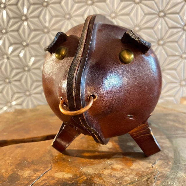 This collection of handcrafted leather animal banks will add honor and whimsy to your study, library or kids room. Or lay...
