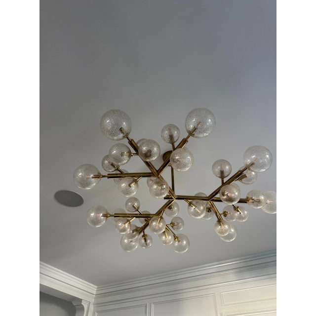 This stunning and dramatic polished brass and handblown Murano glass molecular "Snowflake" was realized in Murano, Italy-...