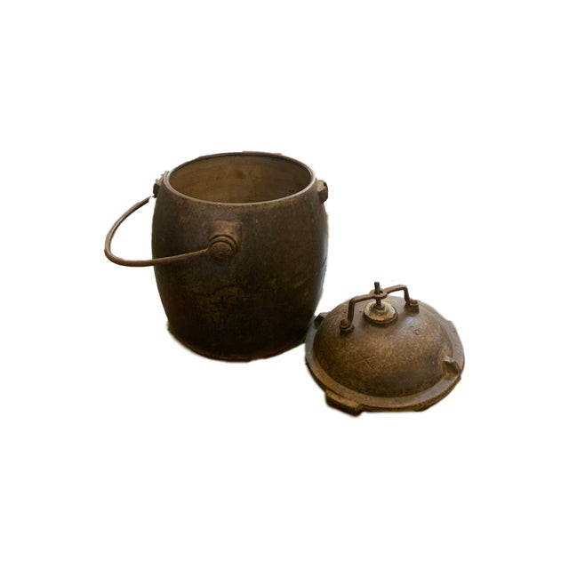 Dimensions: 8" W x 8" D x 13" H Antique iron bucket with removable lid. This rustic container can be a perfect addition to...
