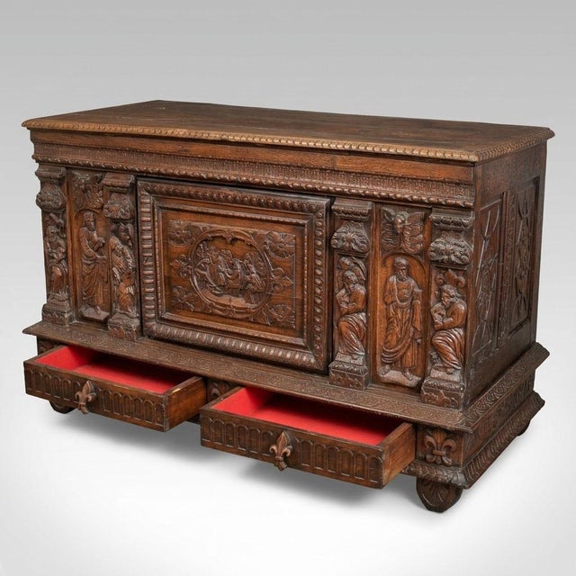 A remarkable piece of solid oak paneling, this low sideboard is in keeping with the tradition of sacristy furniture and...