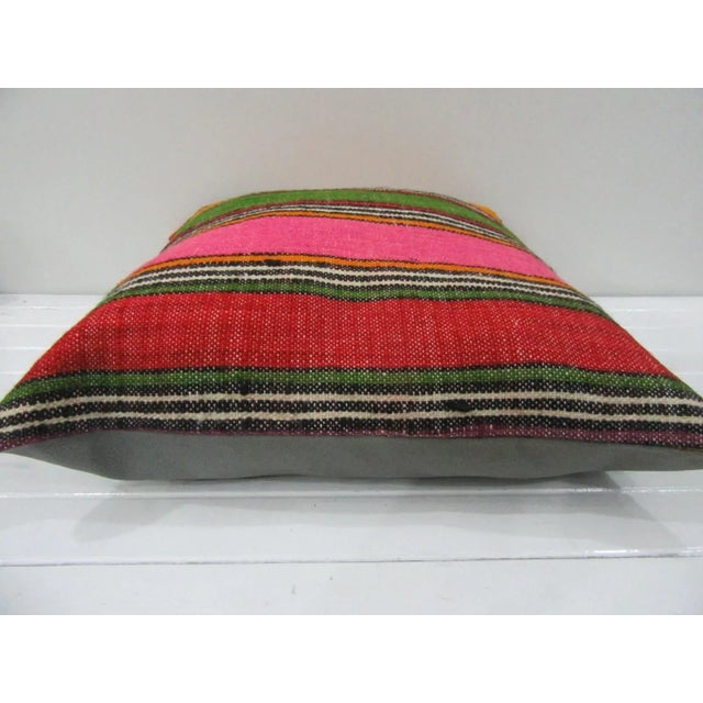 This is a pillow cover made from a vintage kilim rug. The piece was properly washed and ready to use. Pillow inserts not...