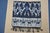 This is a cloth with the following characteristics: warp ikat, not printed decoration predominantly indigo and...