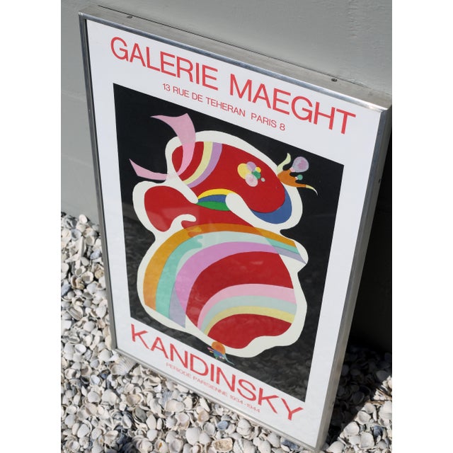 A rare, vintage lithograph print featuring a colorful, abstract design by Wassily Kandinsky. It is mounted in a very...