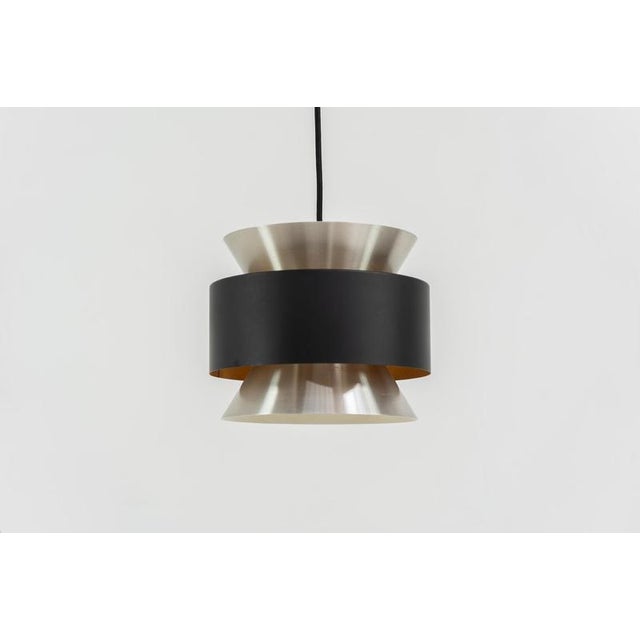 Stunning pendant light by Carl Thore for Granhaga (Sweden, 1960s). A sleek design featuring two aluminium shades and a...