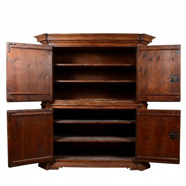 An imposing double-body sideboard/wardrobe dating back to the renaissance (attributable to the 16th century), a...