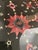 Pink and cream silk embroidery on black linen with small mirrored pieces embroidered in. Star quilt patterns and sawtooth...