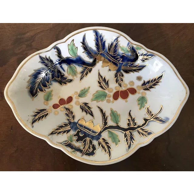 A fine and rare Derby imari dish c. 1770 decorated with patterns of leaves and chestnuts. Oval navette shape with lobed...