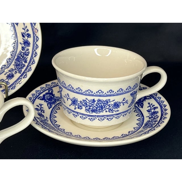Elegant vintage set of four **Royal USA Hampshire** tea cups and matching saucers, crafted in durable ironstone and...