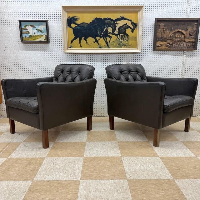 Vintage mid-century Danish modern patinated leather armchairs in the manner of Danish designer, Børge Mogensen. Great...