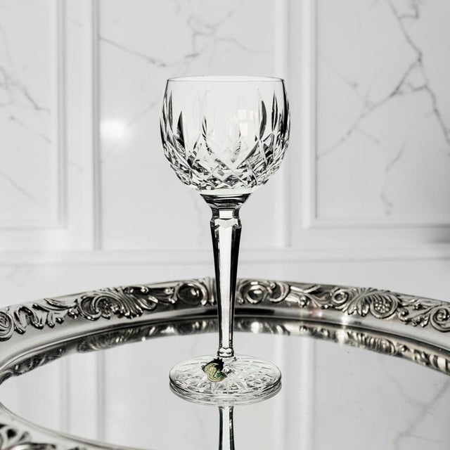 This Waterford Crystal Lismore Hock wine glass was produced in Ireland during the Late 20th Century, circa 1980s–1990s....
