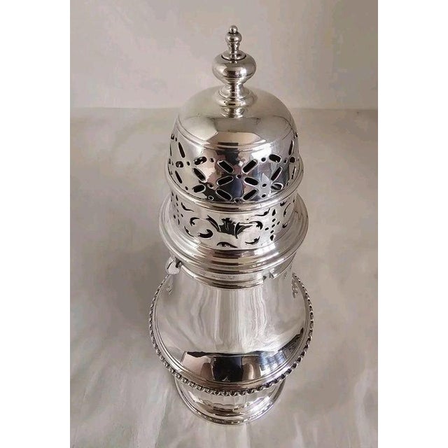 A fine edwardian sterling silver sugar dredger or caster by s.w. Smith & co., fully hallmarked in london for 1906. Of...