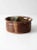 This vintage studio pottery bowl features a beautiful interplay of earthy browns and speckled cream glazes, creating an...