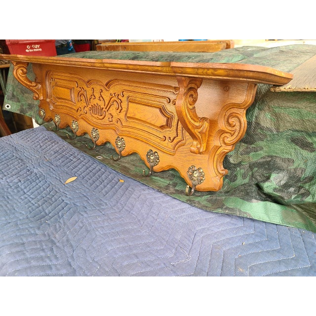 Beautiful antique solid oak wall shelf/coat/hat/plate rack with groove along the top for displaying your plates, it...