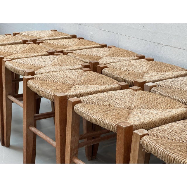 Classic Ticino stools in solid wood with a square frame and slightly tapered legs. The seats are traditionally handwoven...
