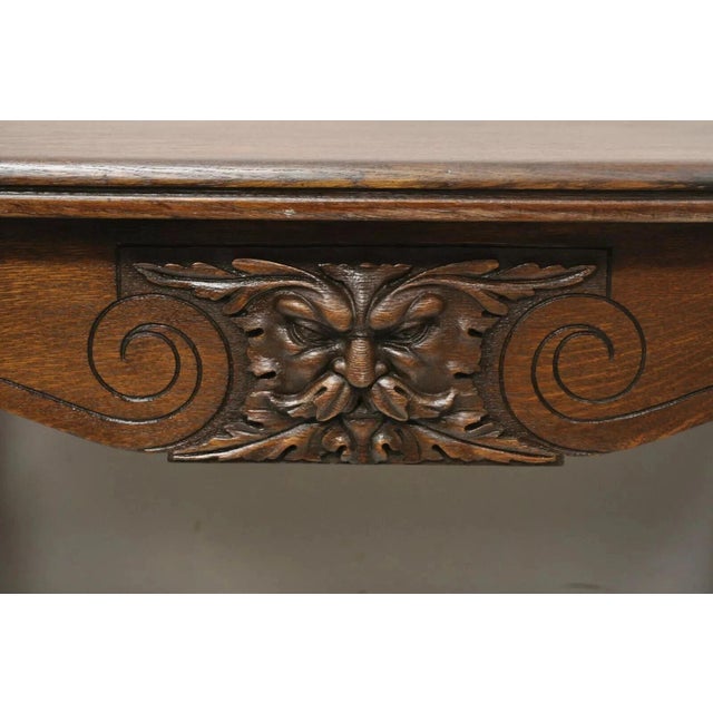 Antique Art Nouveau Carved Oak Northwind Face Desk Library Table with One Large Dovetailed Drawer. Item features carved...