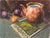This artwork presents a warm, inviting still life featuring a copper teapot alongside vibrant fruits, including a plum and...