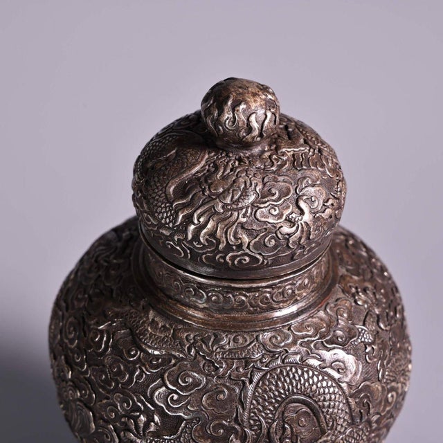 This striking vintage ginger jar is a beautiful example of Chinese-inspired metalwork. Crafted from silvered copper, it...