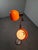 Mid-century floor lamp produced in hungary circa the 1970s, featuring two vibrant orange globe shades and a sleek metal...