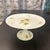 Very attractive antique porcelain cake plate or stand. Hand painted flowers and leaves adorn this pedestal serving dish...