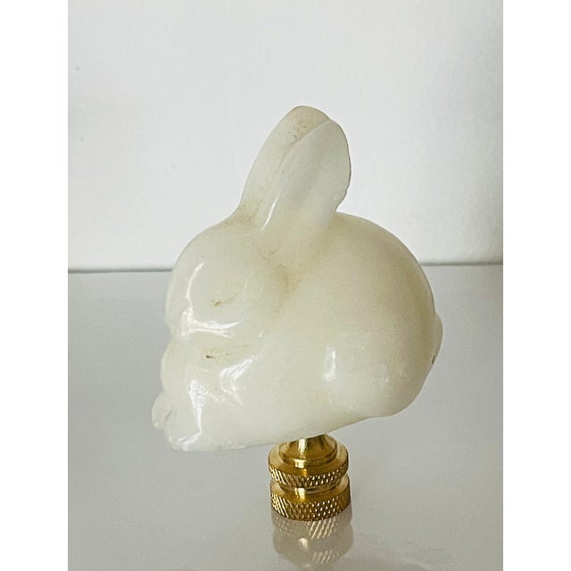 Masterly carved alabaster rabbit figurine mounted on brass base lamp finial.