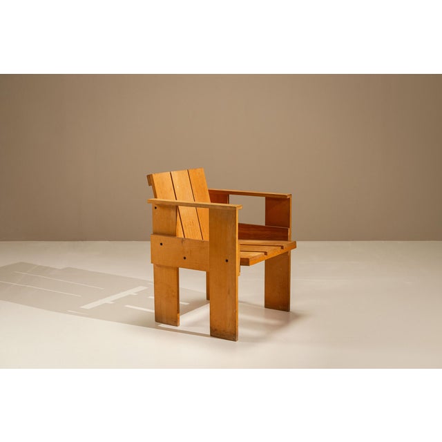 A clear example of Gerrit Rietveld's functional approach to furniture design, the iconic Crate Chair was originally...