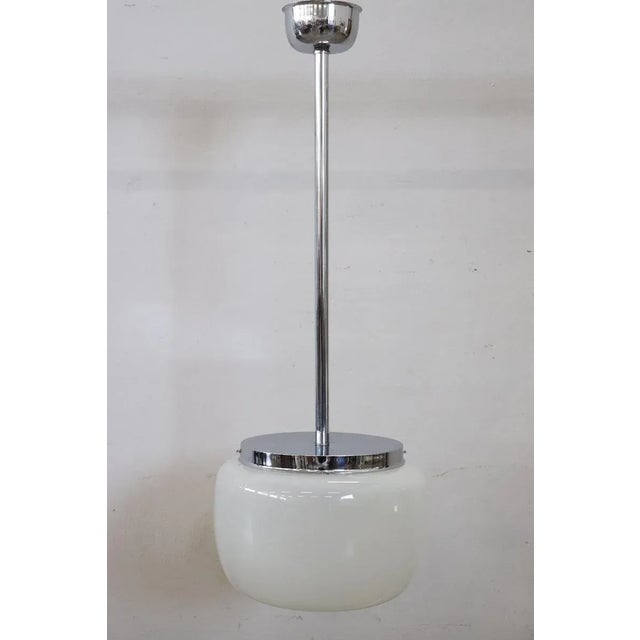 Beautiful and refined italian design pendant liht with white opaline glass and chrome, 1960s. One bulb internal. Fully...