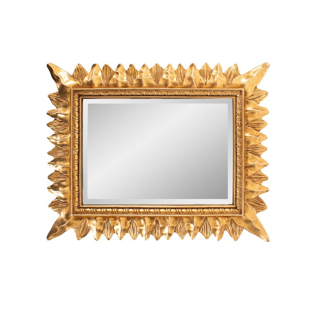 Finished in a luxurious antique gold, the ornate frame adds a touch of classic sophistication, making it a perfect accent...