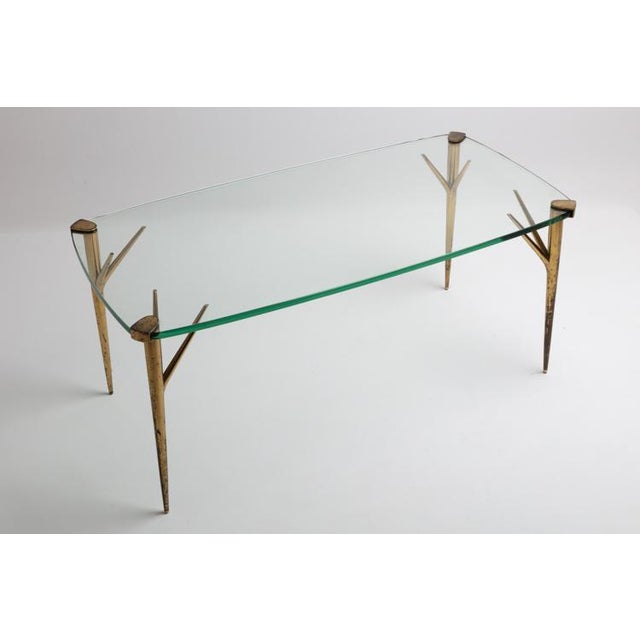 Small table with brass legs and thick glass top. Production fontana arte period 1950s dimensions l. 101 - d. 51 - h. 45 cm...