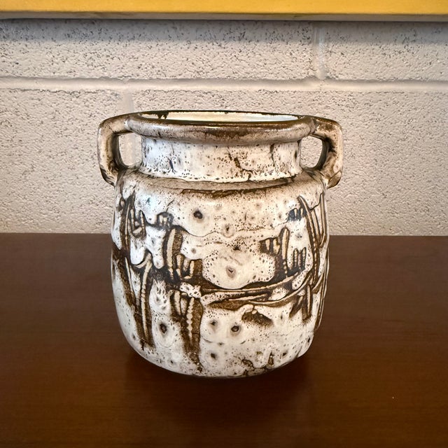 This mid-century Japanese studio art pottery vase showcases a textured, Brutalist surface with organic abstract design in...