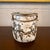 This mid-century Japanese studio art pottery vase showcases a textured, Brutalist surface with organic abstract design in...