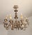 An exceptional large italian chandelier in the louis xv baroque/rococo style, handcrafted from carved wood with a silver-...