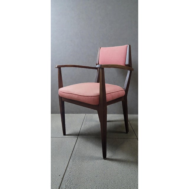 Rosewood armchair from the 1950s. In good condition with minimal signs of wear and age. The fabric is original and free of...