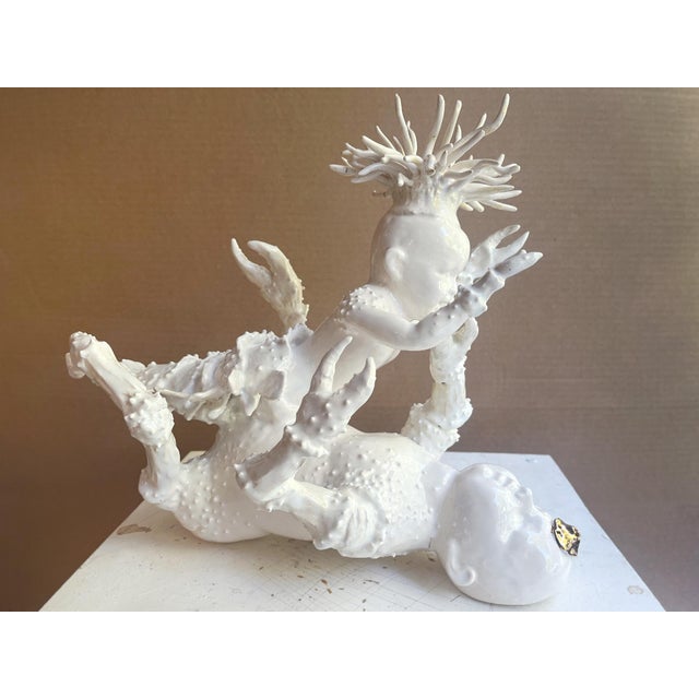 "Lobster Boy #4" by Robert Hechler from his 2026 exhibition "Babes in Lobster Land," featuring a series of porcelain...