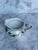 This is an Unger and Schilde lusterware white porcelain creamer with a peralescent glaze and scalloped rim. Circa 1900...