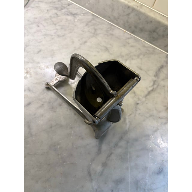 Wear-ever aluminum citrus juicer/. Heavy duty. Collectible and indestructible. Vintage. Gorgeous sculptural display piece....
