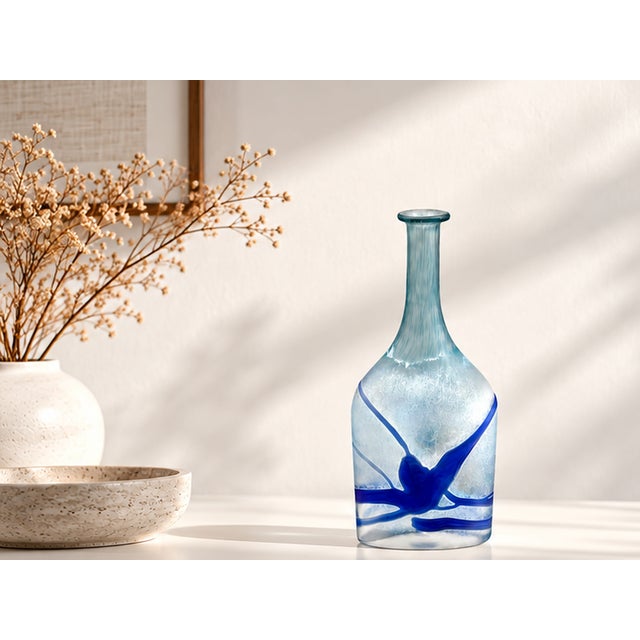 Decorative glass vase from the "Galaxy Blue" series, designed by Bertil Vallien for Kosta Boda in Sweden in the 1980s....