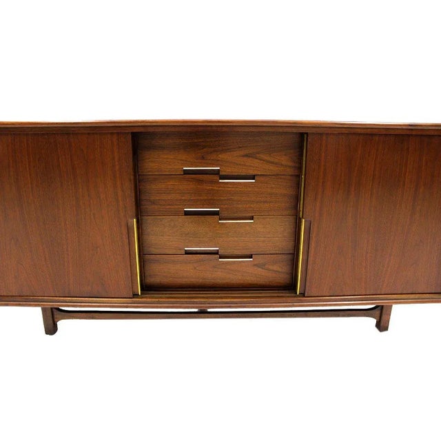 Beautiful walnut Danish mid century modern 12 drawers credenza with sliding doors. Made in the 1960s.