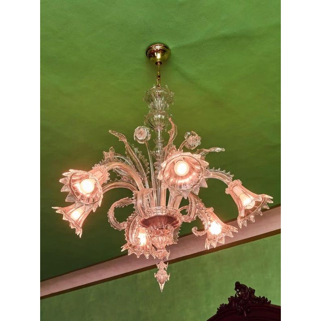 An impressive six-arm chandelier from the famous island of Murano, made around 1950 from hand-shaped split glass. An...
