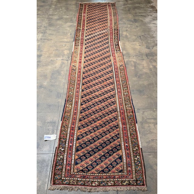 Dating to approximately 1880, this exceptional antique Lory runner is distinguished by its unusually long gallery...